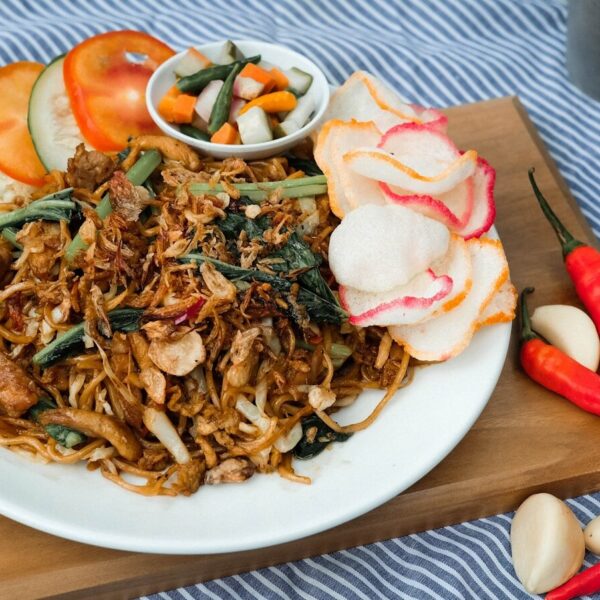 a plate of food on a table with utensils